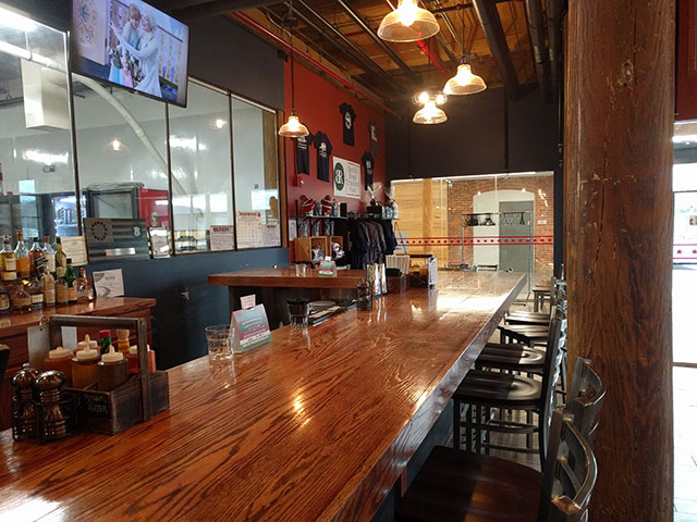 Another angle of the bar, along with the merch selection